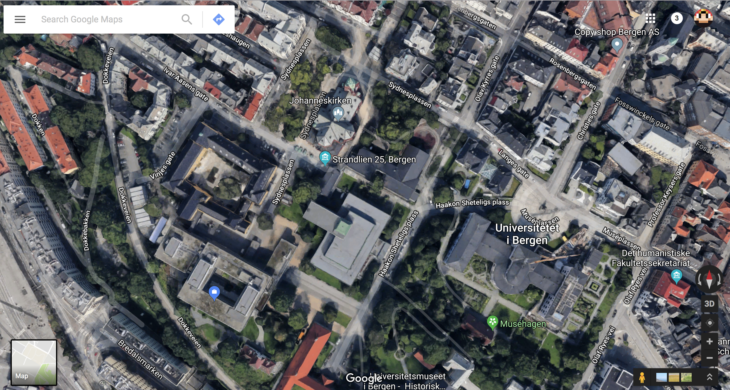 Section of a satellite map image of part of the city of Bergen, showing streets, trees, buildings, parked cars. 