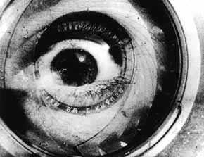 Double exposure of a camera lens and a human eye, black and white.
